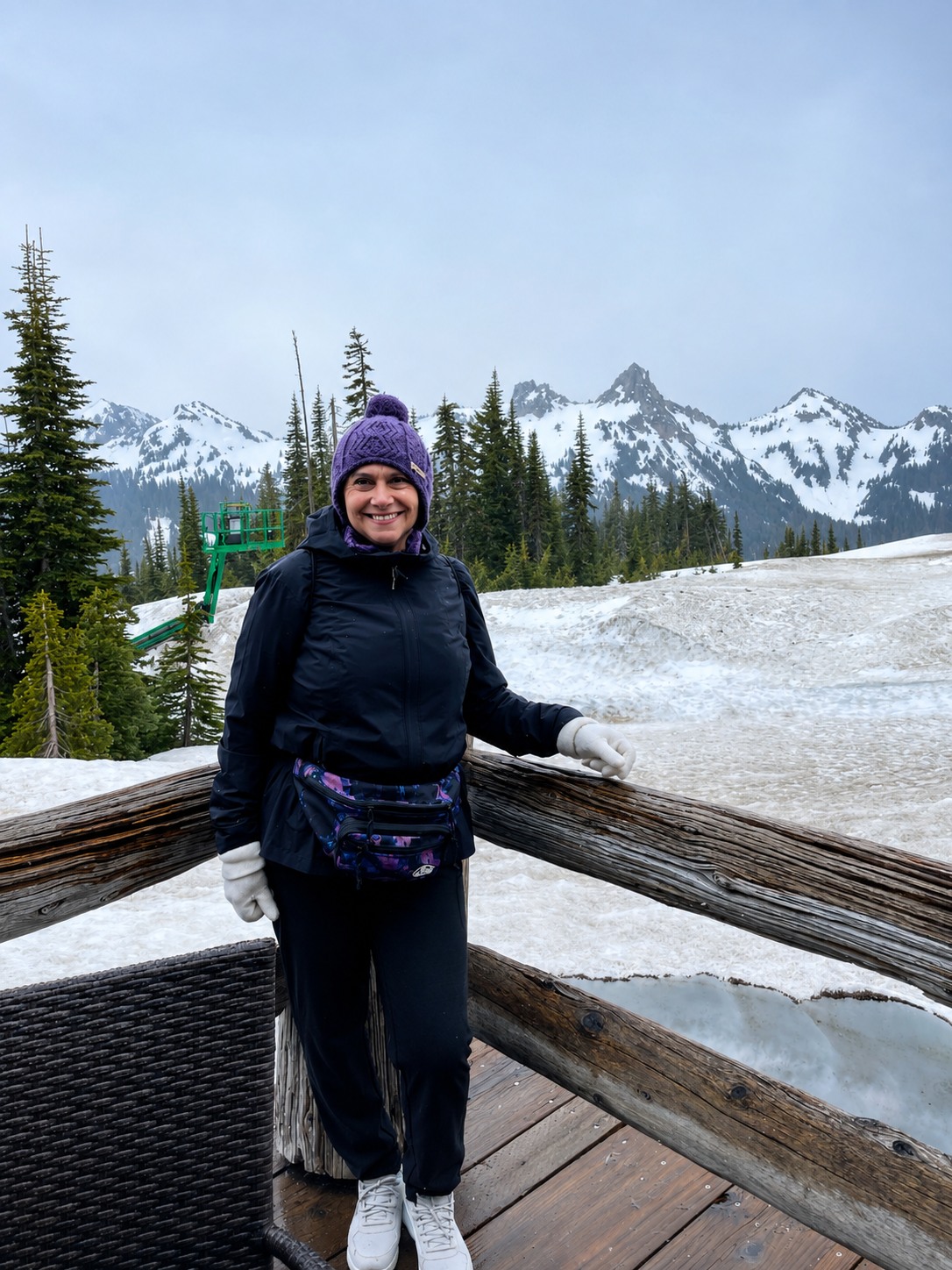 Rosalia smiling during a snowy mountain family vacation